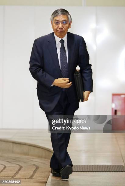 Bank of Japan Governor Haruhiko Kuroda arrives at the central bank's headquarters in Tokyo on Sept. 21 the second day of a two-day policy meeting....