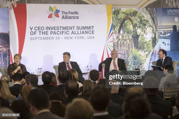 Michelle Bachelet, Chile's president, from left, speaks as Juan Manuel Santos, Colombia's president, Eduardo Ferreyros, Peru's minister of trade, and...