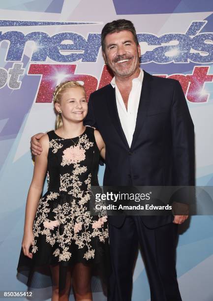 Ventriloquist Darci Lynne and Simon Cowell attends NBC's "America's Got Talent" Season 12 Finale at the Dolby Theatre on September 20, 2017 in...
