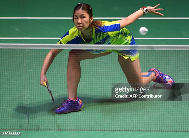 Sonia Cheah of Malaysia hits a return towards Zhang Beiwen of the US during their women's singles second round match at Japan Open Badminton...