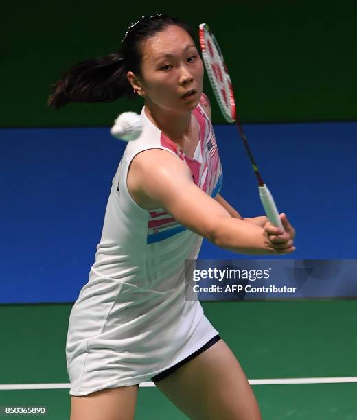 Zhang Beiwen of the US hits a return towards Sonia Cheah of Malaysia during their women's singles second round match at Japan Open Badminton...