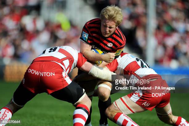 Saracens' Jackson Wray is tackled by Gloucester's Peter Buxton and Andy Hazell during the Aviva Premiership match at Kingsholm Stadium, Gloucester.