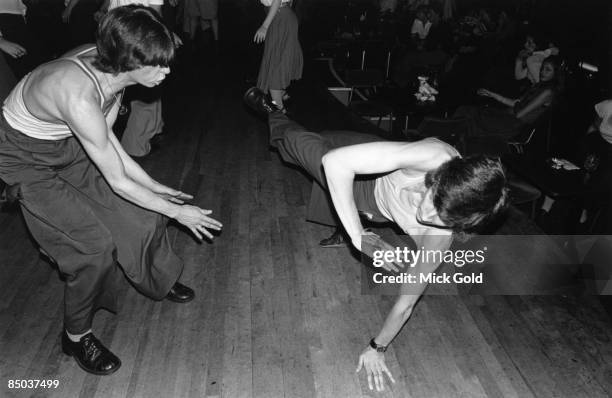 Dancers showing off the characteristic fashions and energetic dance moves of Northern Soul on the dance floor at an 'all-dayer', at The Palais,...