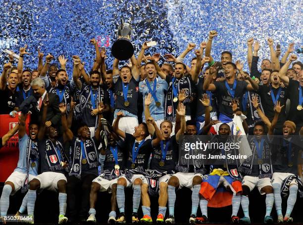 Sporting Kansas City celebrate with the trophy after they defeated New York Red Bulls 2-1 to win the 2017 U.S Open Cup Final at Children's Mercy Park...
