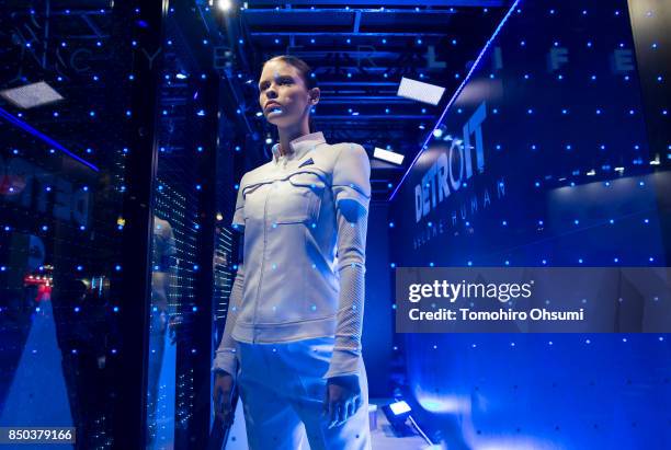 Model wearing a costume of an android character from the Detroit Become Human video game stands in the Sony Interactive Entertainment Inc. Booth...