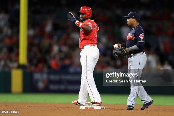 Brandon Phillips of the Los Angeles Angels of Anaheim reaches second on a double as Jose Ramirez of the Cleveland Indians looks on during the fifth...