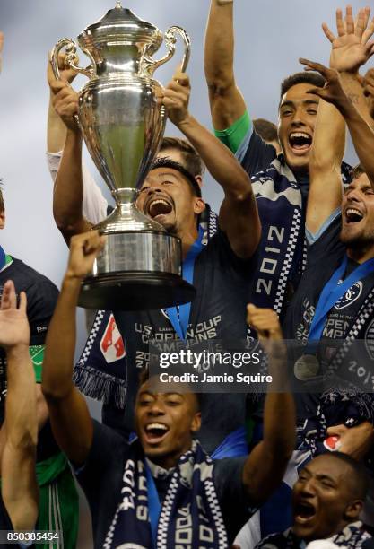 Roger Espinoza and Sporting Kansas City players celebrate with the trophy after defeating the New York Red Bulls 2-1 to win the 2017 U.S Open Cup...