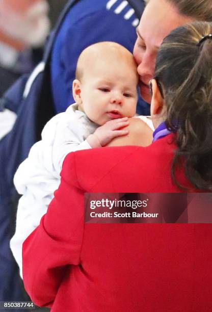 Geelong Cats AFL player Patrick Dangerfield along with his wife Mardi Harwood and son George Dangerfield check in for their flight during a media...