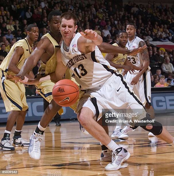 Chas McFarland of the Wake Forest Demon Deacons loses control of the ball while being defended by the Georgia Tech Yellow Jackets at the LJVM...