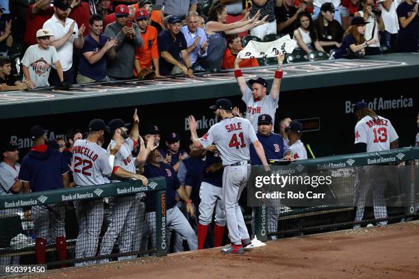 Starting pitcher Chris Sale of the Boston Red Sox celebrates after striking out Ryan Flaherty of the Baltimore Orioles for his 300th strike out of...