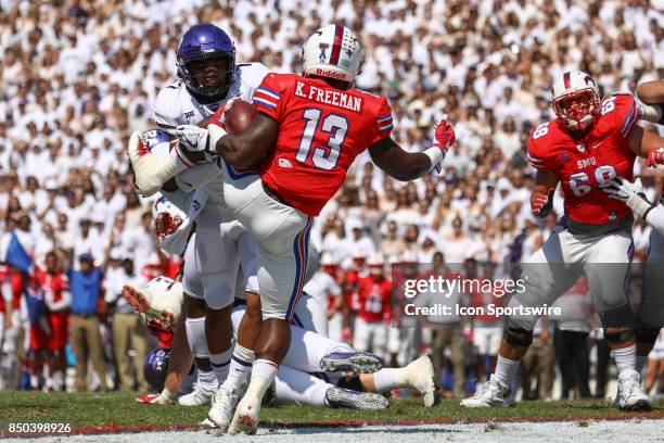 Southern Methodist Mustangs running back Ke'Mon Freeman runs through a tackle attempt by TCU Horned Frogs linebacker Arico Evans for a touchdown...