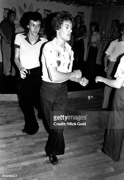 Dancers showing off the characteristic fashions and energetic dance moves of Northern Soul on the dance floor at an 'all-dayer', at The Palais,...