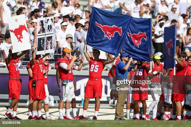 Southern Methodist Mustangs sideline holds signs during the football game between the Southern Methodist Mustangs and Texas Christian Horned Frogs on...