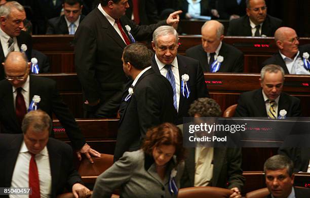 Right-wing Likud party leaer Benjamin Netanyahu chats briefly with extreme right-wing Yisraeli Beiteinu party leader Avigdor Lieberman as Israeli...