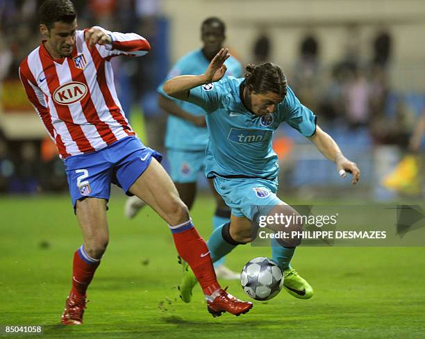 Porto's Uruguayan forward Cristian Rodriguez fights for the ball with Atletico Madrid's Greek defender Giourkas Seitaridis during their Champions...