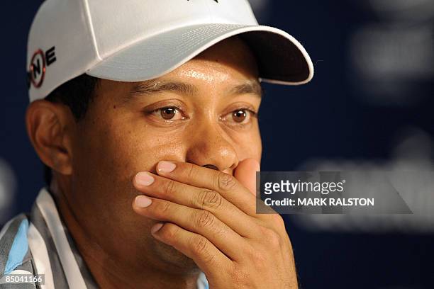 Tiger Woods pauses during a press conference before the start of the Accenture Match Play Championship at the Ritz-Carlton Golf Club at Dove Mountain...