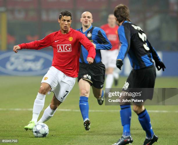 Cristiano Ronaldo of Manchester United clashes with Davide Santon of Inter Milan during the UEFA Champions League First Knockout Round First Leg...