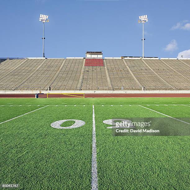 empty football stadium with grandstands. - 50ヤードライン ストックフォトと画像