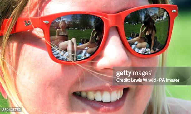 Melina Teske 21, enjoys the hot weather on Clapham Common in London after parts of Britain basked in the warm spring weather but forecasters warned...