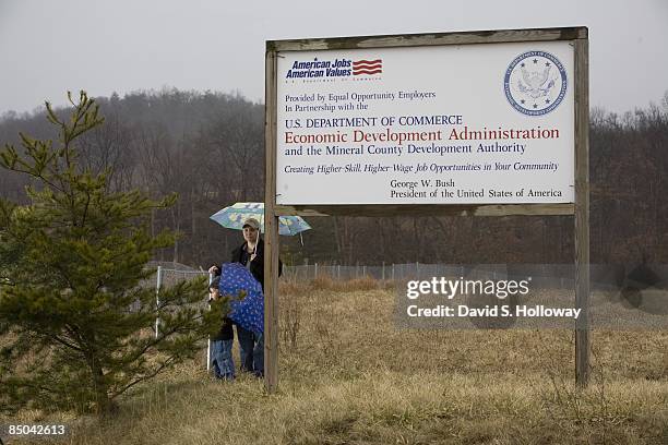 Former soldier Pvt. Lynndie Rana England and her son Carter Allan England pose for a photograph at the industrial park on March 7, 2008 in Fort...