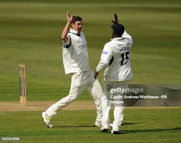 Hampshire's Chris Wood celebrates with team mate Michael Carberry after taking the wicket of Worcestershire's Matthew Pardoe during the LV= County...