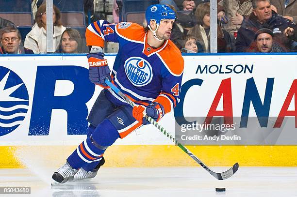 Sheldon Souray of the Edmonton Oilers carries the puck against the Chicago Blackhawks at Rexall Place on December 16, 2008 in Edmonton, Alberta,...