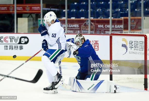 Bo Horvat of the Vancouver Canucks screens teammate Jacob Markstrom during their game-day skate at Mercedes-Benz Arena September 21, 2017 in...