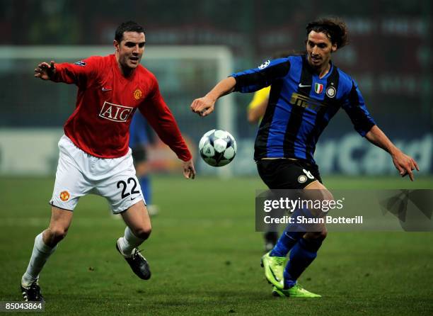 Zlatan Ibrahimovic of Inter Milan and John O'Shea of Manchester United battle for the ball during the UEFA Champions League, Round of Last 16, First...