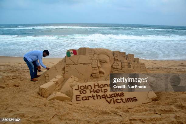 Sand art is seen on the Bay of Bengal Sea's eastern coast at Puri, India, on 21 September 2017 creating by sand artist Sudarshan Pattnaik for public...