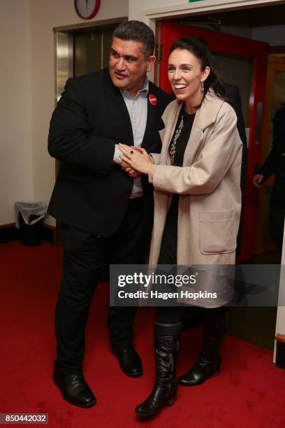 Labour leader Jacinda Ardern is greeted by Rongotai candidate Paul Eagle during a visit to Eagle's phone bank on September 21, 2017 in Wellington,...