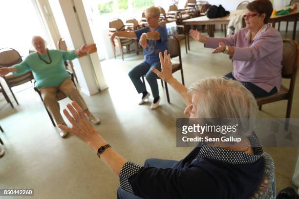 Elderly women participate in an hour-long session of physical exercise at the Mireille Mathieu senior citizens' center on September 20, 2017 in...
