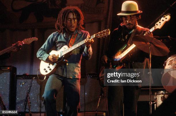 Photo of WAILERS and Aston 'Family Man' BARRETT and Bob MARLEY, Bob Marley performing live on stage at the Odeon with bass player, Aston 'Family Man'...