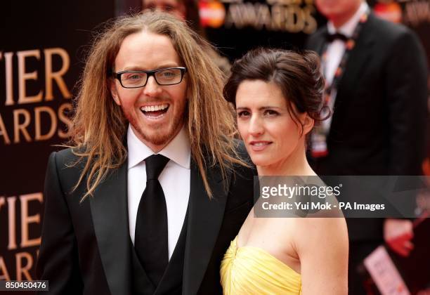 Tim Minchin and his wife Sarah arrive at the Olivier Awards 2013, at the Royal Opera House, in Covent Garden, central London.