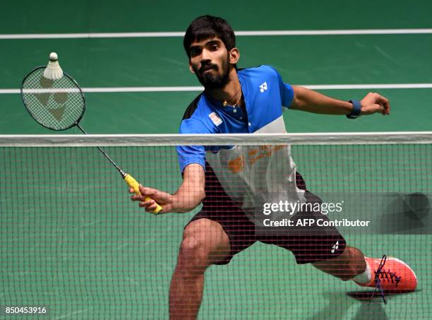 Srikanth Kidambi of India hits a return against Hu Yun of Hong Kong during their men's singles second round match at the Japan Open Badminton...