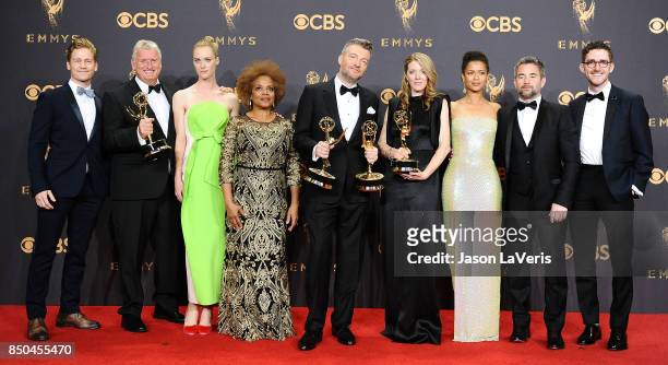 Writer-producer Charlie Brooker and cast and crew of 'Black Mirror', winners of Outstanding Television Movie, pose in the press room at the 69th...