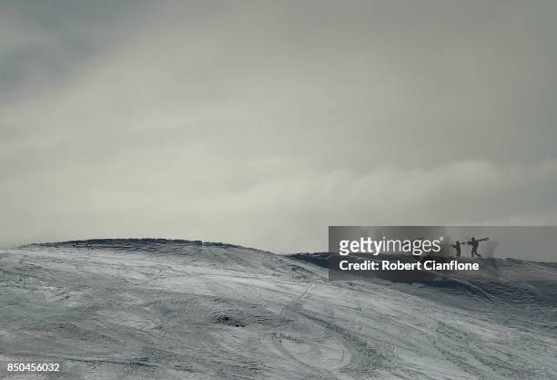 Skiers walk up the summit on September 21, 2017 in Mount Buller, Australia. Australians are enjoying one of the best ski seasons after the best...