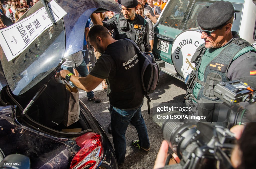 The civil guard confiscates documentation during the...