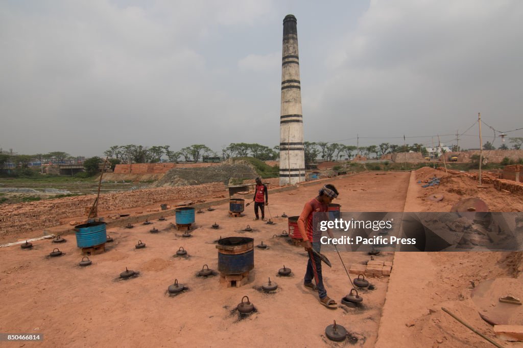 Back Breaking These workers are carrying out back-breaking and exhausting labour in ...
