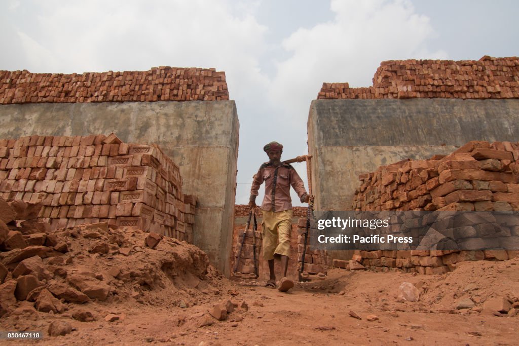 Back Breaking These workers are carrying out back-breaking and exhausting labour in ...