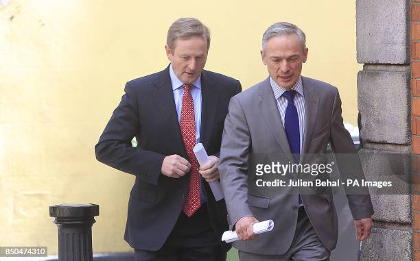 Taoiseach Enda Kenny arriving with Minister for Enterprise Richard Bruton at the press conference in the Westbury Hotel, Dublin at the jobs...
