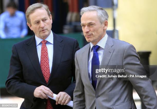 Taoiseach Enda Kenny arriving with Minister for Enterprise Richard Bruton at the press conference in the Westbury Hotel, Dublin at the jobs...