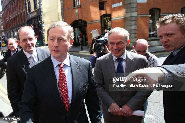 Taoiseach Enda Kenny and Minister for Enterprise Richard Bruton arrive for the press conference in the Westbury Hotel, Dublin at the jobs...