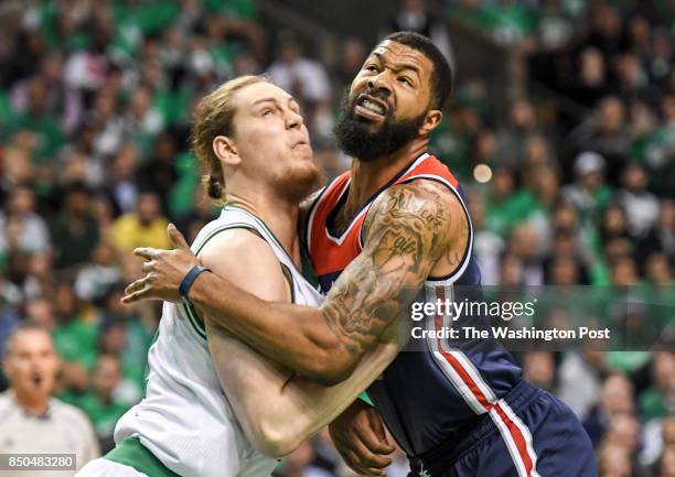 Washington Wizards forward Markieff Morris battles Boston Celtics center Kelly Olynyk for position under the basket during game seven of the Eastern...