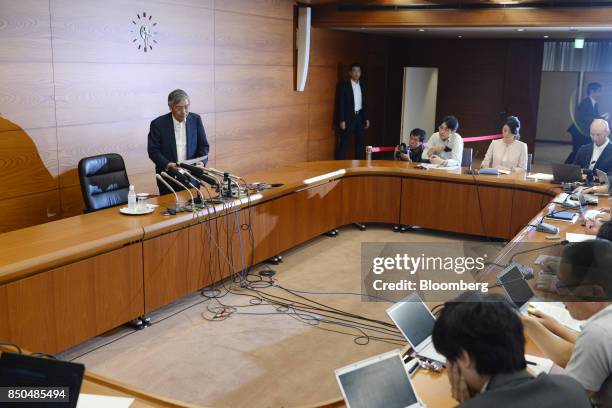 Haruhiko Kuroda, governor of the Bank of Japan , left, arrives for a news conference in Tokyo, Japan, on Thursday, Sept. 21, 2017. Just hours after...