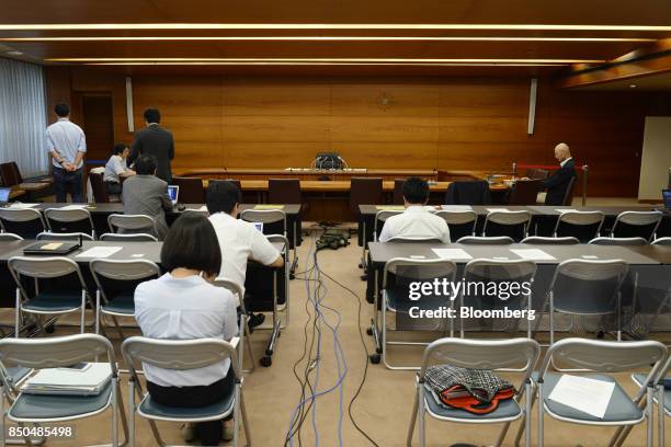 Members of the media wait for Haruhiko Kuroda, governor of the Bank of Japan , to arrive for a news conference in Tokyo, Japan, on Thursday, Sept....