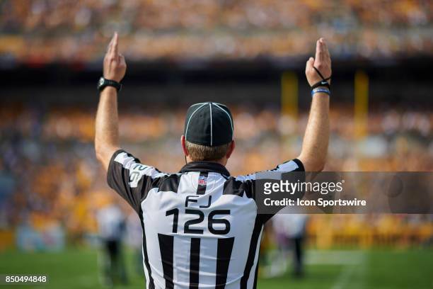 Referee is seen signaling a touchdown during an NFL football game between the Minnesota Vikings and the Pittsburgh Steelers on September 17, 2017 at...