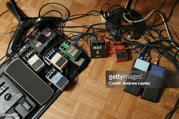 Photo of GUITAR PEDALS; A selection of guitar effects pedals and leads on studio floor