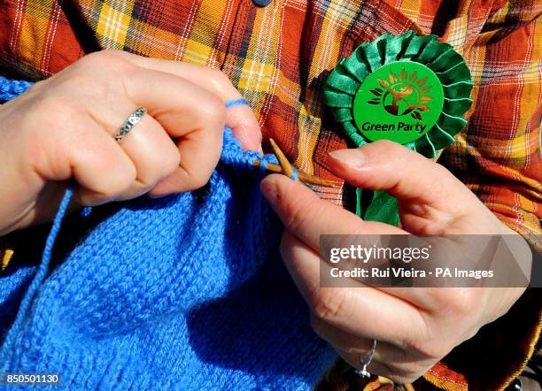 Green Party member knitting outside a temporary polling station outside Crows Nest Public House, Nuneaton, as voters go to the polls in local...