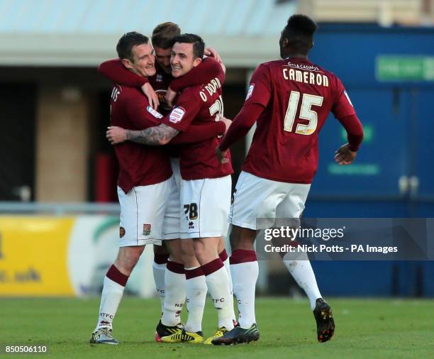 Northampton Town's Roy O'Donovan celebrates scoring the opening goal during the npower Football League Two, Play Off Semi Final, First Leg at...