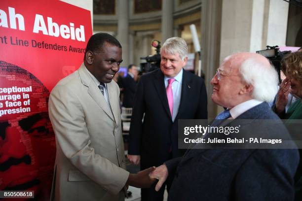 Biram Dah Abeid from Mauritania the winner of the 2013 Front Line Defenders Award for Human Rights Defenders at Risk greets President Michael D...